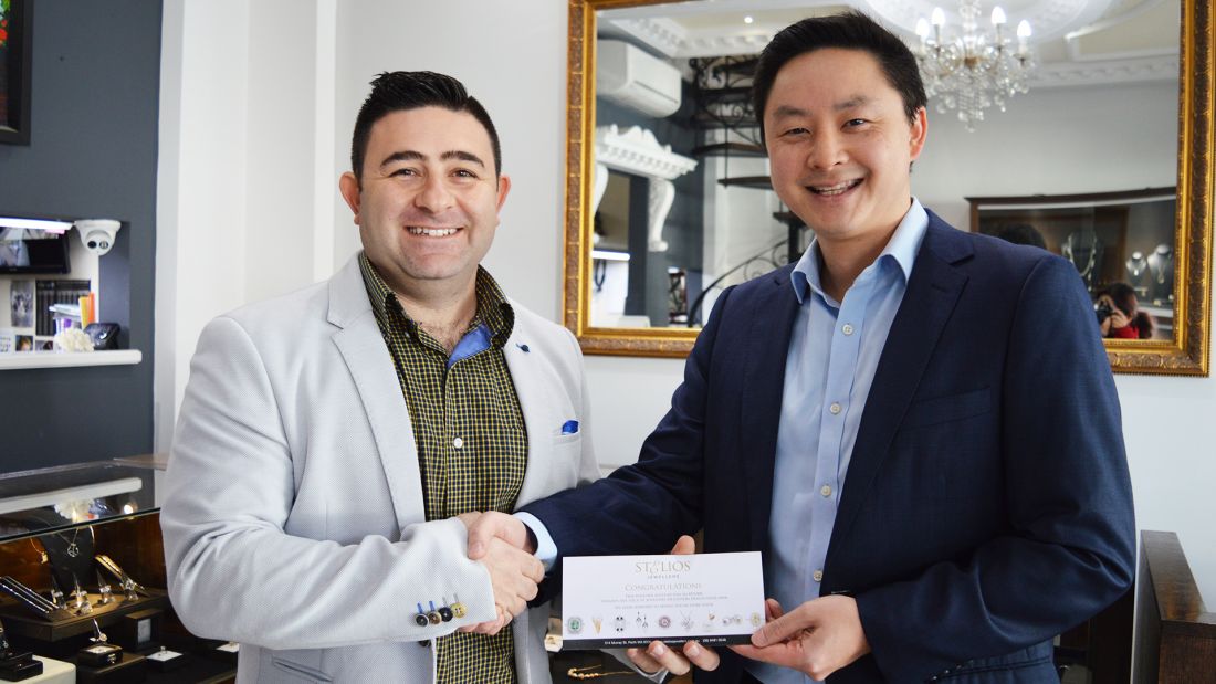 Darren Kam, TSH Artitude Amplified 2018 1st place winner, receives his prize from Stelios Jewellers