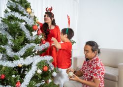 Activities like decorating the Christmas tree offer opportunities to teach new words and language.