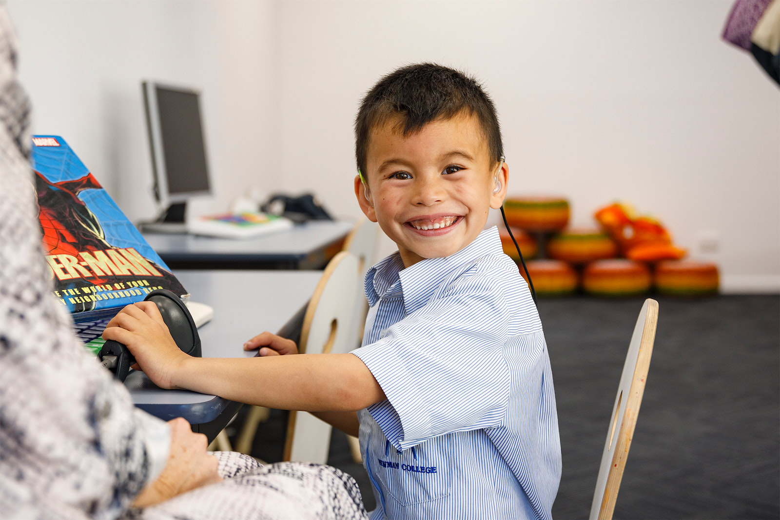 A child undergoing audiological therapy