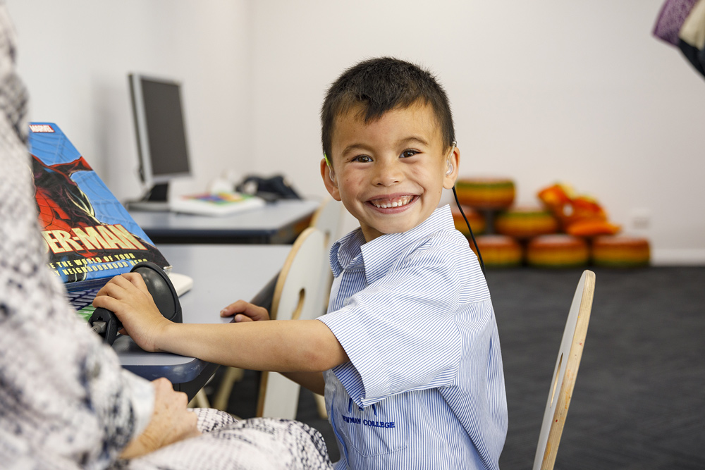 A child undergoing audiological therapy