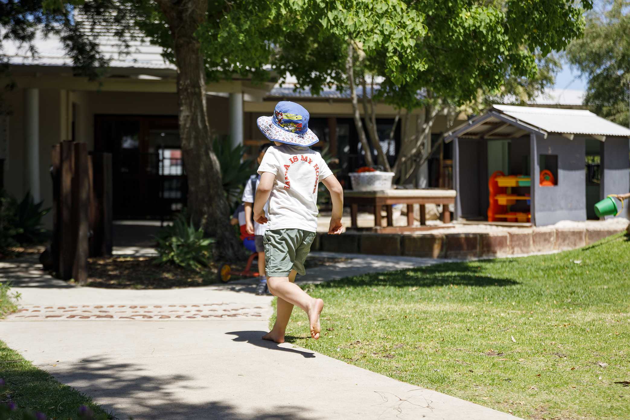 Child running through the playground.